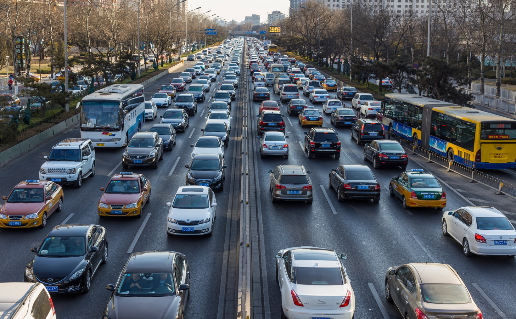 Heavy urban traffic congestion on a multi-lane city road during peak hours.