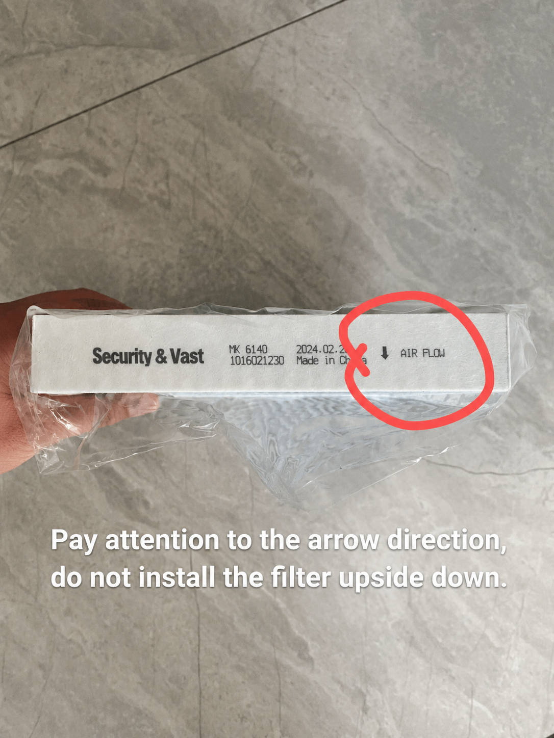 Brand new cabin air filter in original packaging with AIR FLOW directional arrow clearly marked, showing correct installation orientation to avoid installing upside down.