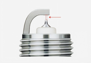 spark plug gap—the clearance between the center electrode and the ground electrode